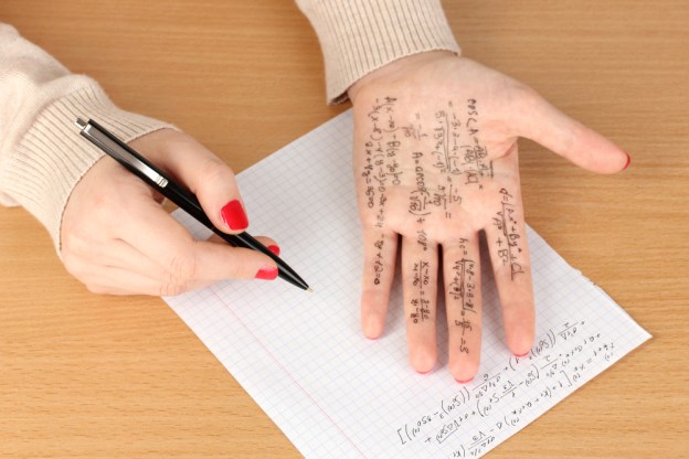 hand with test notes written on it